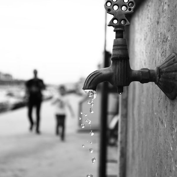 Person in a dynamic yoga flow pose, blurred background suggesting movement.